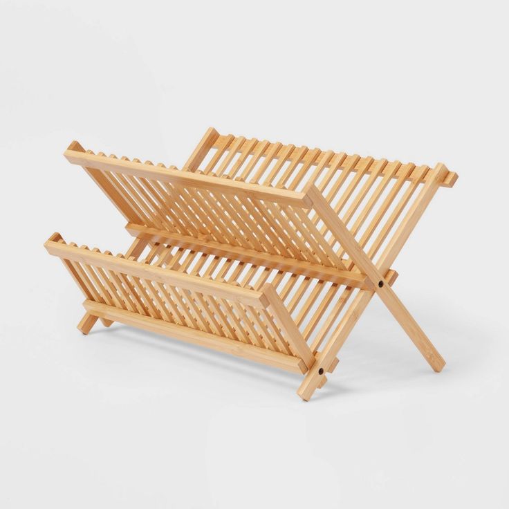 two wooden folding chairs sitting next to each other