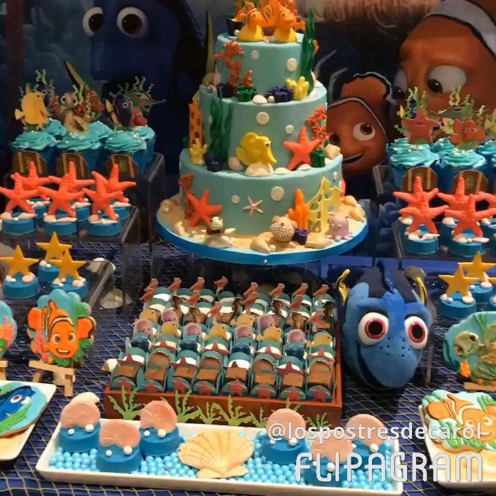 an under the sea themed birthday cake and cupcakes