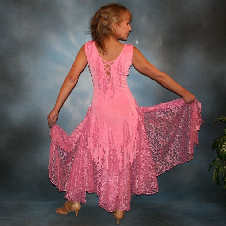 will fit size 1/2-5/6, very stretchy Fancy up your ballroom dance feet with this sweet pink Converta ballroom dress! Its slinky solid light pink stretch fabric and individually handcrafted & sewn-on Barcelona lace petals are dripping with glittery light rose Swarovski hand beading accents. The accompanying ballroom skirt is yards of Barcelona lace, so you can glide across the dance floor in no time. Feel like royalty when you spin and dip like a pro in this lush ensemble - so elegant, graceful, Pink Fitted Dress For Dance, Pink Fitted Dance Dress, Pink Stretch Floor-length Dress, Fitted Belly Dance Dress, Rhythm Dress, Latin Dress, Swarovski Beads, Pink Solid, Light Rose