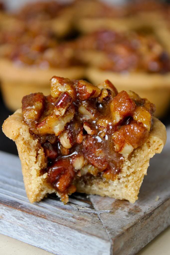 a close up of a muffin on a wooden table