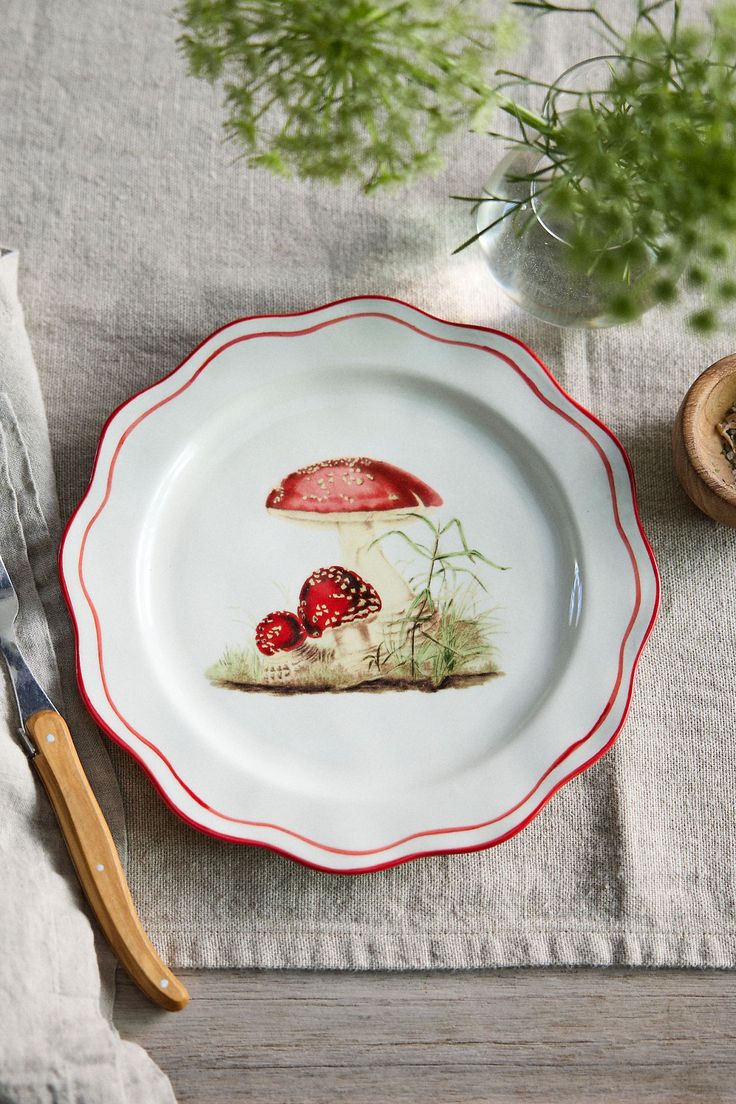 a plate with mushrooms painted on it