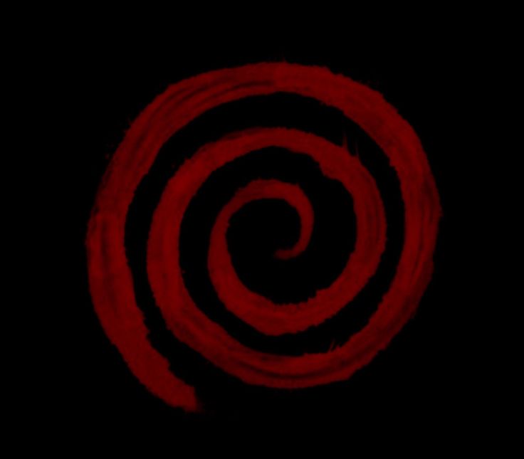 a black and red spiral design on a dark background