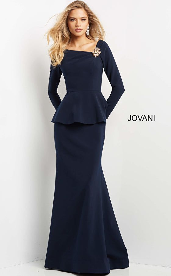 Jovani 07131 - Long sleeve gown with an asymmetrical neckline that features a crystal brooch like embellishment. The gown features a peplum at the waist. Long Sleeve Evening Gowns, Unique Prom Dresses, Glamorous Dresses, Gowns Of Elegance, Dress Silhouette, Groom Dress, Mother Of The Bride Dresses, Elegant Dress, Dress Backs