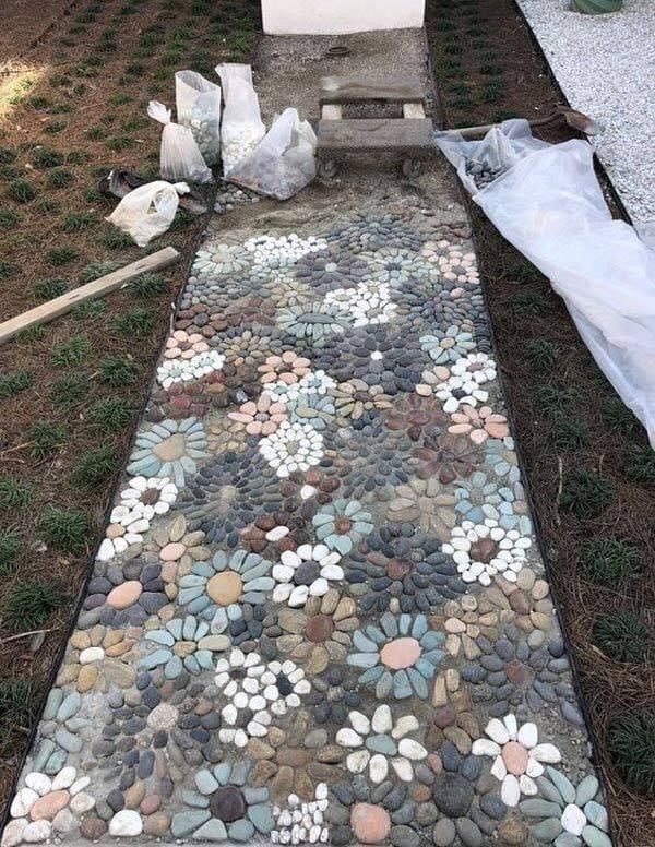 a garden path made out of rocks and stones