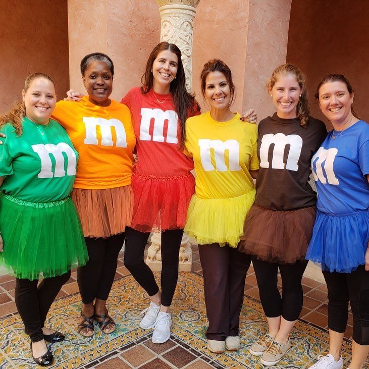 four girls in tutu skirts are posing for the camera with their mom t - shirts