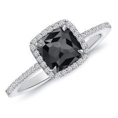 a black and white diamond ring on a white background