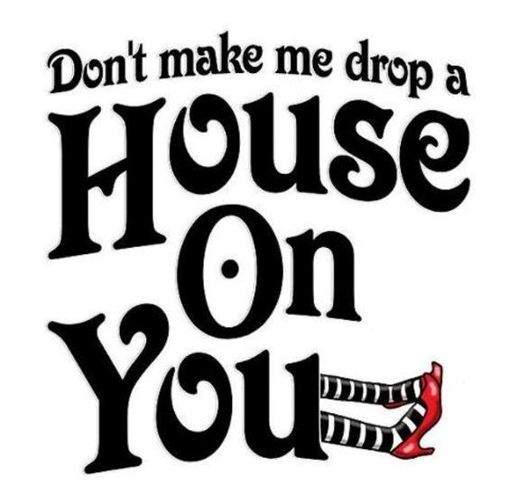 a pink poster with the words don't make me drop a house on you