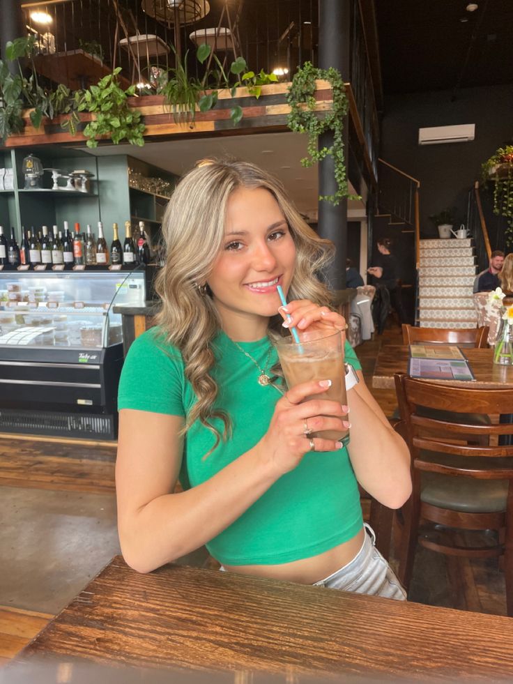 girl at coffee shop holding iced coffee smiling for instagram pictures Poses For Pictures Instagram Coffee Shop, Ig Post Ideas Photo Coffee Shop, Cute Coffee Shop Pictures, Coffee Shop Pics Photo Ideas, Coffee Shop Pictures Instagram, Coffee Shop Instagram Pictures, Coffee Pictures Instagram, Coffee Shop Poses, Coffee Shop Pics