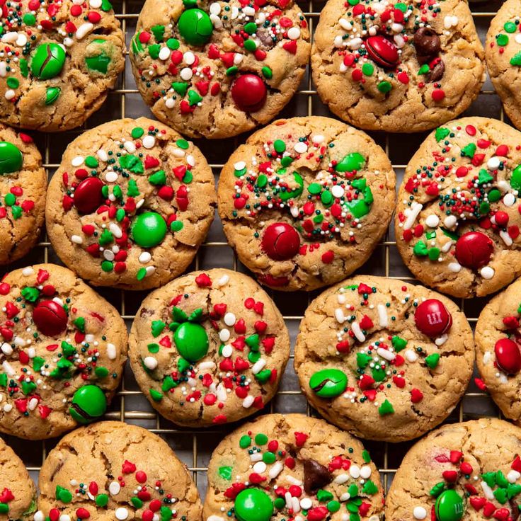 chocolate chip cookies with candy and m & m's sprinkles on a cooling rack