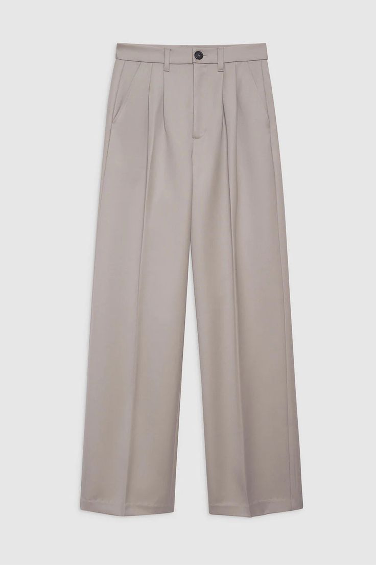 Designed by Anine Bing. The Carrie Pant in white linen blend is a wide-leg trouser made from a light and breathable linen blend. This full-length style features double-pleated front detailing, five functional belt loops, two faux back welt pockets, slanted front pockets, and a single button zip-front closure. Fully lined. Fit: The Carrie Pant is cut for a high-rise fit, relaxing through the thigh into a wide-leg hem. Take your true size. Model is wearing a size 32. Model Measurements: Height: 5' Beige Wide Leg Pants With Belt Loops, Tailored Beige Wide Leg Pants, Formal Beige Wide Leg Pants With Belt Loops, Classic Neutral Pants With Belt Loops, Neutral Full-length Wide Leg Pants For Work, Neutral Wide Leg Pants For Formal Occasions, Neutral Full Length Wide Leg Pants For Work, Formal Neutral Wide Leg Pants, Beige Wide Leg Pants With Welt Pockets