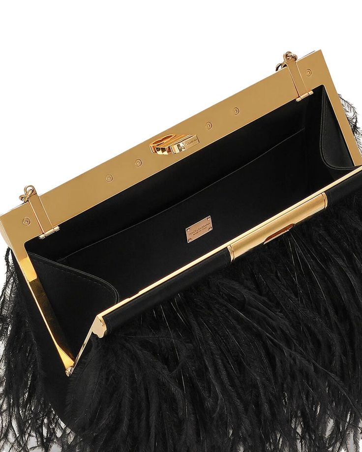 Dolce & Gabbana Medium Marlene Fringe Shoulder Bag in Black Vintage brass turn-lock fastening Chain shoulder strap Embellished ostrich feathers Satin lining Interior flat wall pocket 9” W x 5.5” H x 1.7” D Made in Italy Luxury Evening Bag With Feather Trim, Luxury Evening Bags With Feather Trim, Luxury Formal Bags With Feathers, Elegant Evening Bags With Feathers, Luxury Formal Feathered Bags, Elegant Bags With Feather Trim For Events, Chic Formal Bags With Feathers, Formal Chic Bags With Feathers, Chic Formal Feather Bags