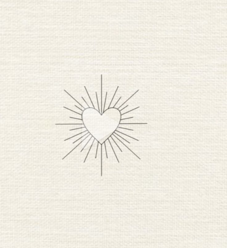 a heart drawn in the middle of a white paper with sun rays coming out of it