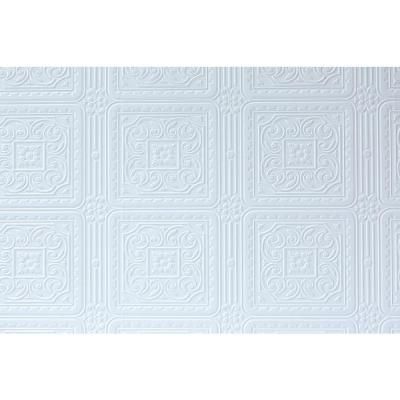 a white wall with an intricate design on it