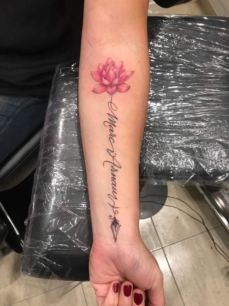 a woman's arm with a pink flower on it and the words, i love you