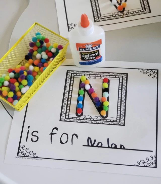 the letter n is for m is for m with beads in front of it and a container of candy