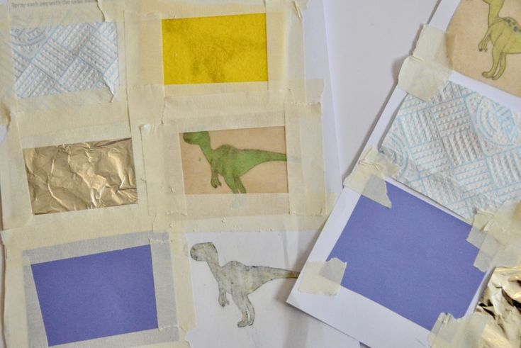 several pieces of paper with different colored images on them and one is cut out to look like a dinosaur