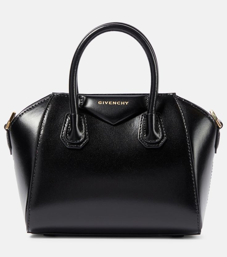 Antigona Toy leather tote bag in black - Givenchy | Mytheresa Black Calf Leather Shoulder Bag With Handles, Black Calf Leather Satchel With Leather Handles, Black Calf Leather Satchel With Top Handle, Black Calf Leather Satchel With Top Carry Handle, Black Calf Leather Bag With Top Handle, Black Calf Leather Top Handle Bag, Black Calf Leather Satchel With Gold-tone Hardware, Black Calf Leather Bag With Detachable Handle, Luxury Black Calf Leather Satchel