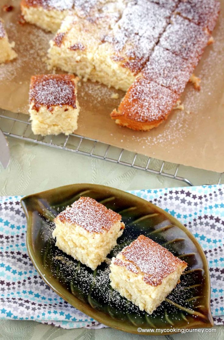 two pieces of cake sitting on top of a green plate