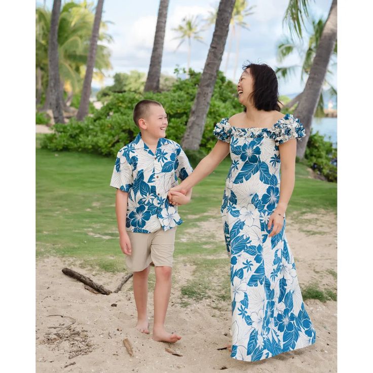 Leilani Holoku Hawaiian Dress Capture the essence of Hawaii in the Leilani Holoku dress, crafted with beautiful and stunning floral Hawaiian dress featured in a flattering, classy silhouette. Square neckline with pinched ruffles Elastic ruffled cap sleeves Flattering front and back darts Center back zip Cotton Poplin Made in Hawaii, USA Available in sizes S - XL Blue Hawaiian Dress With Tropical Print, Blue Tropical Dress With Hibiscus Print, Blue Fitted Hawaiian Dress, Pali Hawaii Sandals, Hawaiian Muumuu, Aloha Dress, Aloha Print, Muumuu Dress, Hawaii Usa