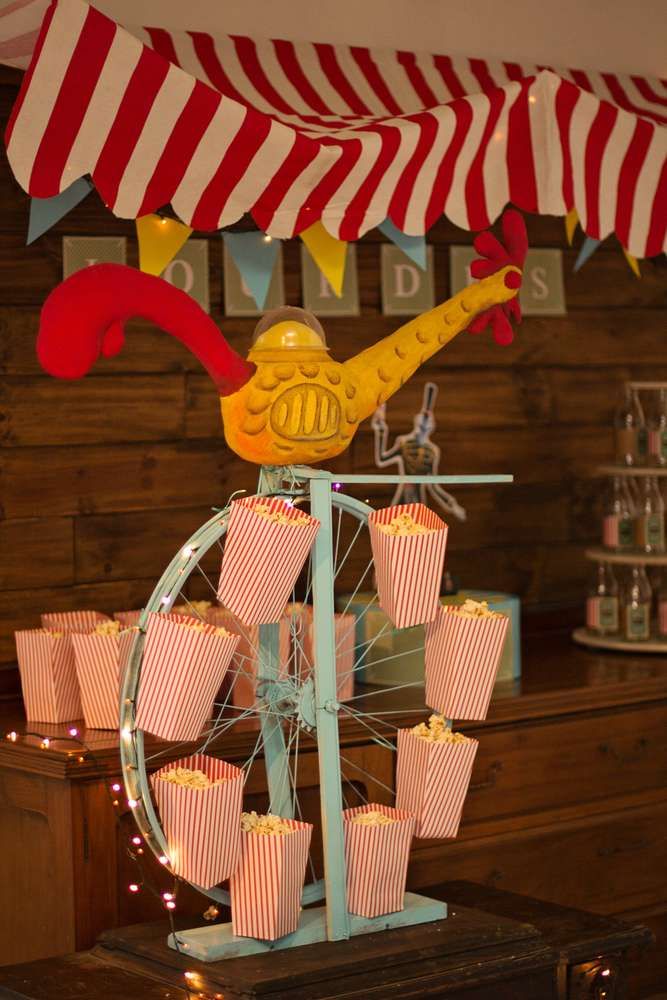 a ferris wheel with some cupcakes in front of it