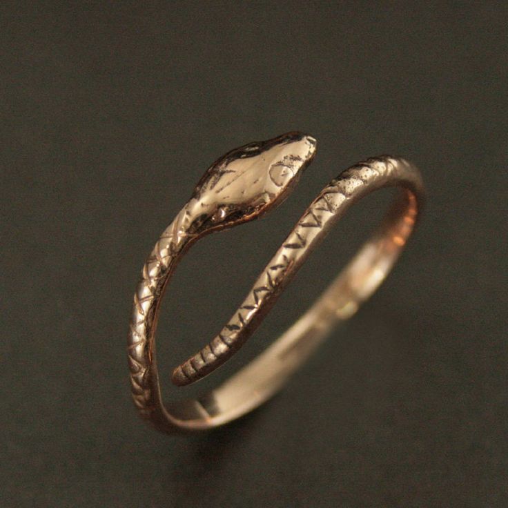 This Solid 14K Gold snake ring will surely become one of your favorite accessories! Inherently stylish, this ring is hand cast in our studio in your choice of solid 14K gold: Rose, White or Yellow. Your ring will be made to size just for you, but is also adjustable for any occasion or weather. The snake measures approximately 2mm wide by 1.5mm thick (varying along his length). And his head measures 4mm wide by about 8mm long. He coils effortlessly around your finger for a unique accessory that w Handmade Adjustable Snake Shape Rings, Adjustable Symbolic Snake Ring, Unique Adjustable Snake Ring For Anniversary, Symbolic Adjustable Snake Ring For Anniversary, Adjustable Yellow Gold Snake Ring, Adjustable Gold Snake Ring Symbolic, Adjustable Unique Yellow Gold Snake Ring, Adjustable Gold Symbolic Snake Ring, Adjustable Snake-shaped Symbolic Rings