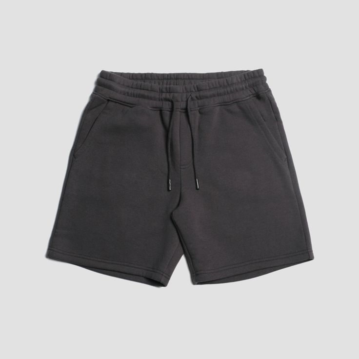 Welcome to elevated comfort. If you're a fan of our Seeker Volley, you're going to love the Loftloom Sweat Shorts! We've taken the same perfect fit from our most popular short and crafted them with a premium lofty brushed fleece that is heavyweight, warm & crazy comfortable. Our Loftloom material is made from 60% Cotton & 40% recycled polyester and fits perfectly to maximize days meant for lounging. The Details: Material: 60% Cotton 40% Polyester Sustainably Sourced 17" Length Silicone D Basic Relaxed Fit Shorts, Basic Relaxed Fit Short Leg Bottoms, Basic Cotton Shorts, Basic Cotton Bottoms With Built-in Shorts, Gray Shorts With Elastic Waistband, Solid Bermuda Shorts With Relaxed Fit, Comfortable Gray Short Leg Bottoms, Basic Shorts With Pockets, Gray Comfort Waistband Shorts