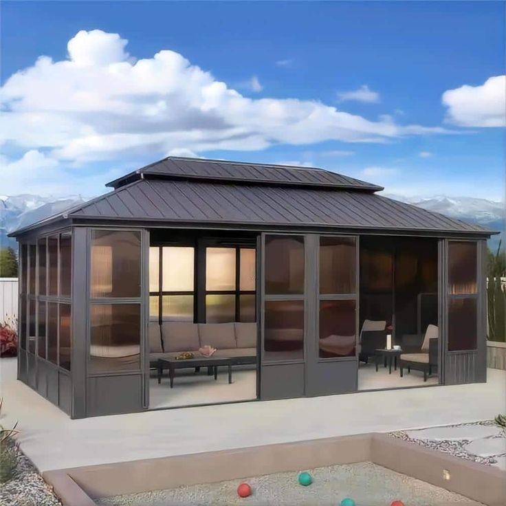 a gazebo with chairs and tables in the background