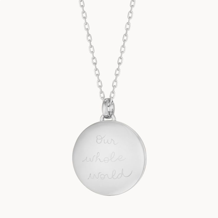 Our weighted Personalized Locket Necklace Sterling Silver can be hand-engraved on the inside and out, keeping your loved ones and special memories close to heart.925 Sterling SilverLoquet charm: 0.8 diameterSecure clasp fasteningCharms are removable from this chain and can be worn on all Merci Maman chain lengthsHand-engraved in our Paris studioSent with love in a complimentary gift boxAny slight variations in lettering depth, spacing and alignment from the examples shown are part of the aesthetic and originality of the piece White Gold Pendant Charm Necklace With Lobster Clasp, Gift Charm Necklace With Polished Round Pendant, Gift Charm Necklace With Round Pendant And Polished Finish, Gift Charm Necklace With Polished Finish And Round Pendant, Silver Engraved Round Necklace, White Gold Charm Pendant Necklace For Anniversary, Silver Pendant Charm Necklace For Keepsake, Pendant Charm Necklaces With Polished Finish For Anniversary, White Gold Pendant Charm Necklace For Anniversary