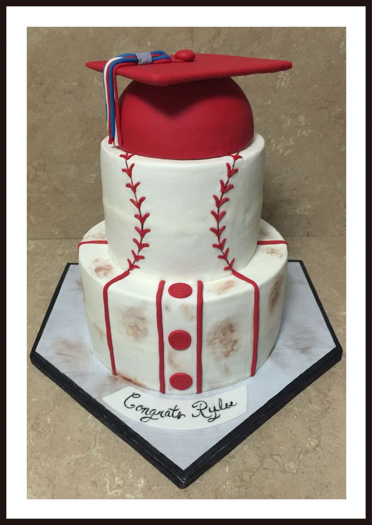 a baseball themed cake with a red cap on top