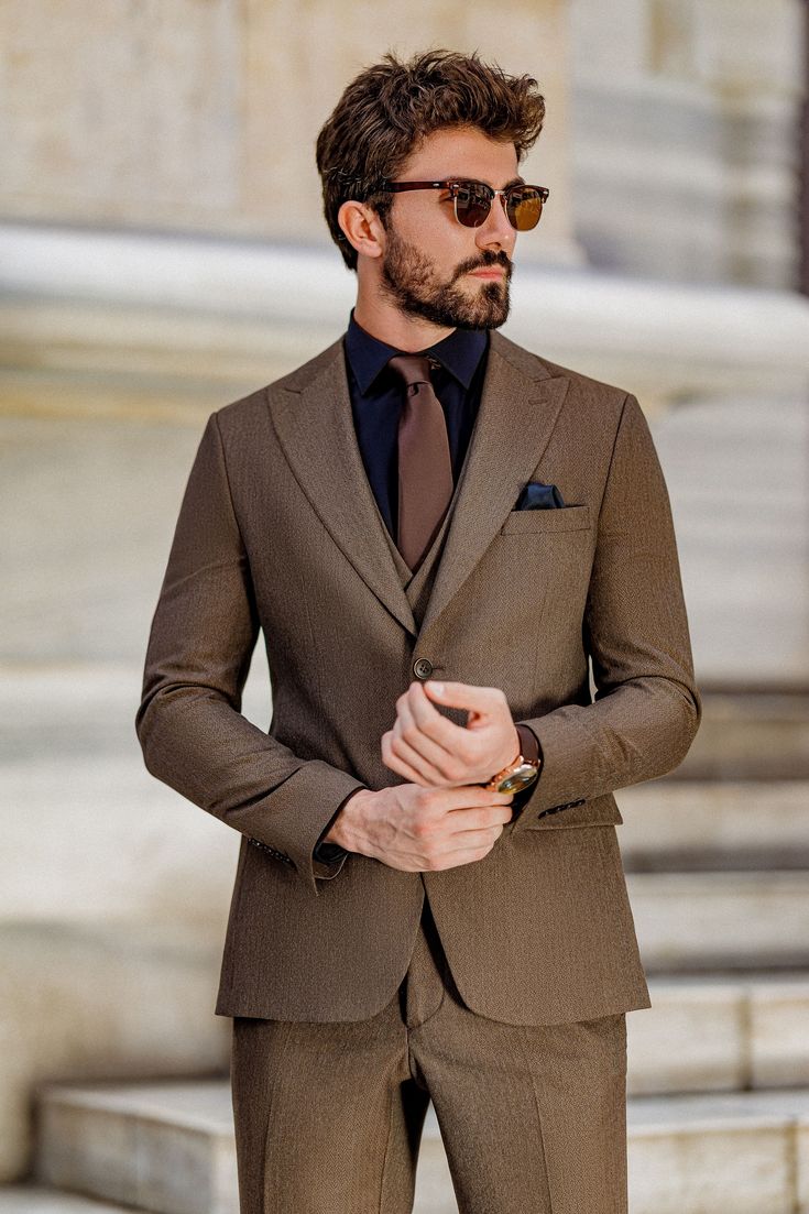 Elevate your formal attire with the Brown Slim-Fit Suit 3-Piece. This suit’s rich brown color and sharp, tailored fit provide the perfect balance of tradition and modernity, ensuring you stand out in any setting.  #brownslimfitsuit #elegantmenswear #classylook #formalfashion #modernfit #tailoredsuit #professionalstyle #sharpdressing #businessattire #menssuit Brown Suit Combinations Mens Fashion, Black And Brown Suit, Brown Suit Men, Brown Suit Wedding, Black Suit Designs, Coat Pant For Men, Brown Suits For Men, Urdu Vocabulary, Suit Styles