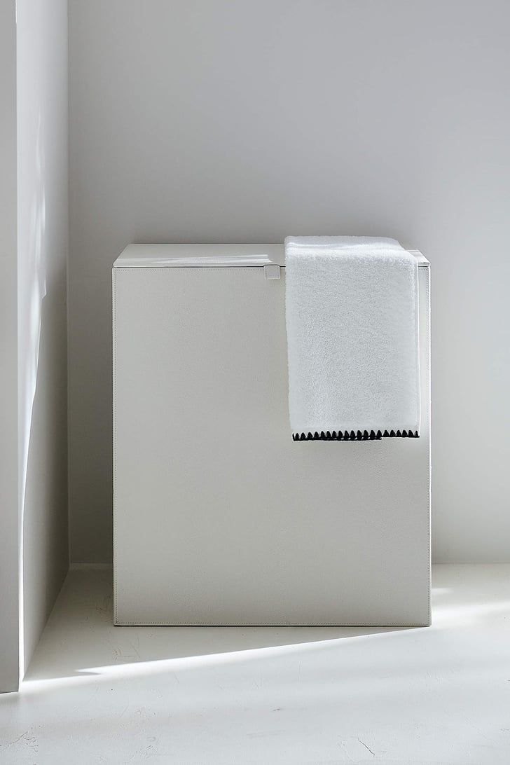 a white box with a towel on top of it