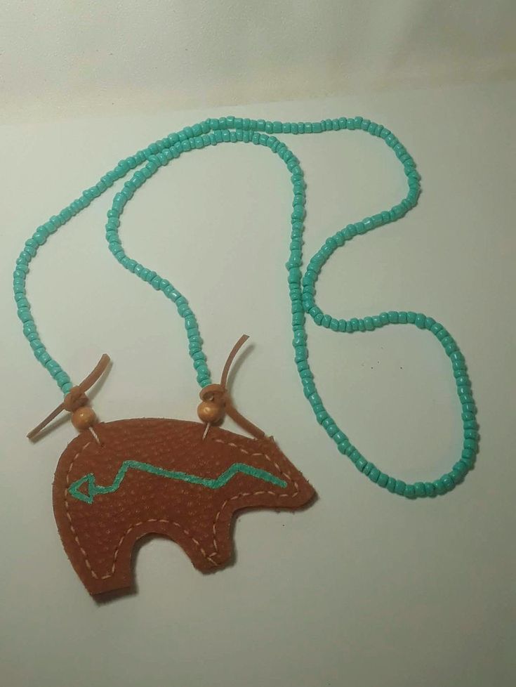 Handmade Leather Bear Amulet Necklace Handmade Southwestern Brown Necklace, Handmade Brown Southwestern Necklace, Handmade Adjustable Brown Turquoise Necklace, Southwestern Style Hand Tooled Necklace As Gift, Artisan Brown Turquoise Necklace Hand-strung, Handmade Brown Necklaces For Everyday Use, Southwestern Style Brown Beaded Necklace For Gift, Southwestern Style Brown Beaded Necklace As A Gift, Southwestern Style Brown Beaded Necklace Gift