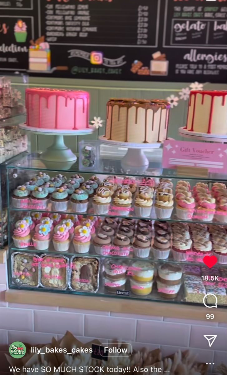 a display case filled with lots of different types of cupcakes on top of each other