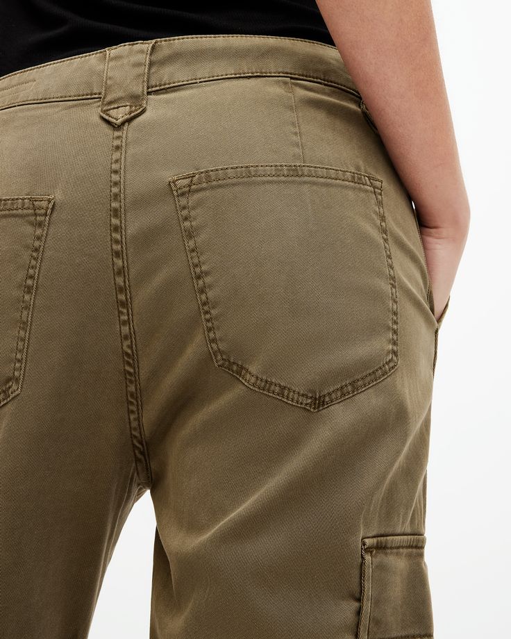 Swap your sweatpants out. Try the Nola Joggers. They're crafted from a stretch cotton-blend fabric that's super comfortable. Finished with classic cargo pocket detailing - pair them with a bodysuit for an easy look that goes from day to night.    These trousers are designed to a slim fit High-rise Zip closure Ankle length Cuffed ankles Stretch fabric Four cargo pockets Zip side seam at the ankle Allsaints Relaxed Fit Cotton Bottoms, Relaxed Fit Straight Leg Sweatpants With Multiple Pockets, Relaxed Fit Cargo Joggers With Straight Leg, Relaxed Fit Straight Leg Cargo Joggers, Allsaints Straight Leg Bottoms Relaxed Fit, Allsaints Straight Leg Relaxed Fit Bottoms, Allsaints Relaxed Fit Straight Leg Bottoms, Utility Sweatpants With Hip Pockets And Tapered Leg, Allsaints Casual Bottoms For Fall