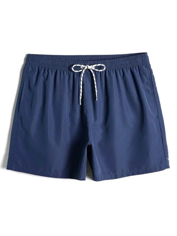 Dive into style and comfort with Drawstring Waist Solid Swim Trunks. These swim trunks feature a classic solid color design, making them versatile and easy to pair with any swimwear ensemble. The drawstring waist ensures a secure and adjustable fit. Upgrade your swimwear collection with these essential trunks for a timeless and stylish look. Specifications: Style: Boho Pattern Type: Plain Details: Drawstring Type: Bottoms Bottom Type: Shorts Fabric: Non-Stretch Material: Fabric Composition: 100% Polyester Care Instructions: Machine wash or professional dry clean Size Chart (inches): Size Bottoms Length Hip Size Waist Size S 15.9 44.5 30.5-39 M 16.3 46.1 32.1-40.6 L 16.7 48 34.1-42.5 XL 17 50 36-44.5 XXL 17.4 52 38-46.5 Casual Tie-side Swimwear For Swimming, Casual Tie-side Bottom Swimwear For Pool, Solid Color Swimwear With Drawstring For Beach Season, Solid Swimwear With Drawstring For Beach Season, Blue Drawstring Swim Trunks For Beach Season, Stretch Swim Trunks With Drawstring For Beach, Nylon Swimwear With Drawstring For Beach Season, Nylon Swimwear With Drawstring For Swimming, Sporty Navy Swim Trunks For Pool