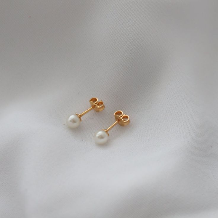 Delicate, mini pearl earrings for your everyday outfits! Cheap Minimalist Pearl Earrings With Charm, Classic Everyday Pearl Drop Earrings, Everyday Pearl White Drop Earrings, Pearl White Drop Earrings For Everyday Wear, Dainty Pearl White Earrings For Pierced Ears, Delicate Pearl Charm Earrings For Everyday, Delicate Everyday Earrings With Pearl Charm, Gold Pearl Drop Cartilage Earrings As Gift, Delicate Everyday Pearl Charm Earrings