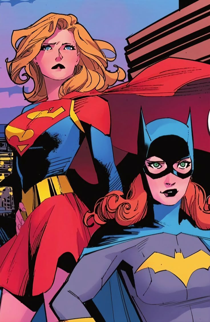 two women dressed as batman and batgirl standing next to each other