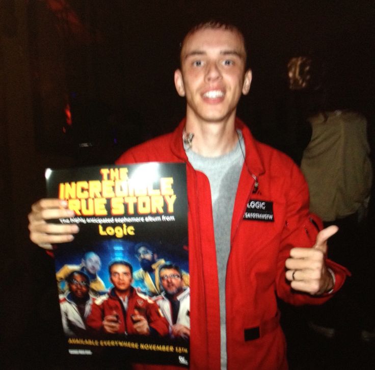 a man in a red jacket is holding up a dvd cover for the incredible true story