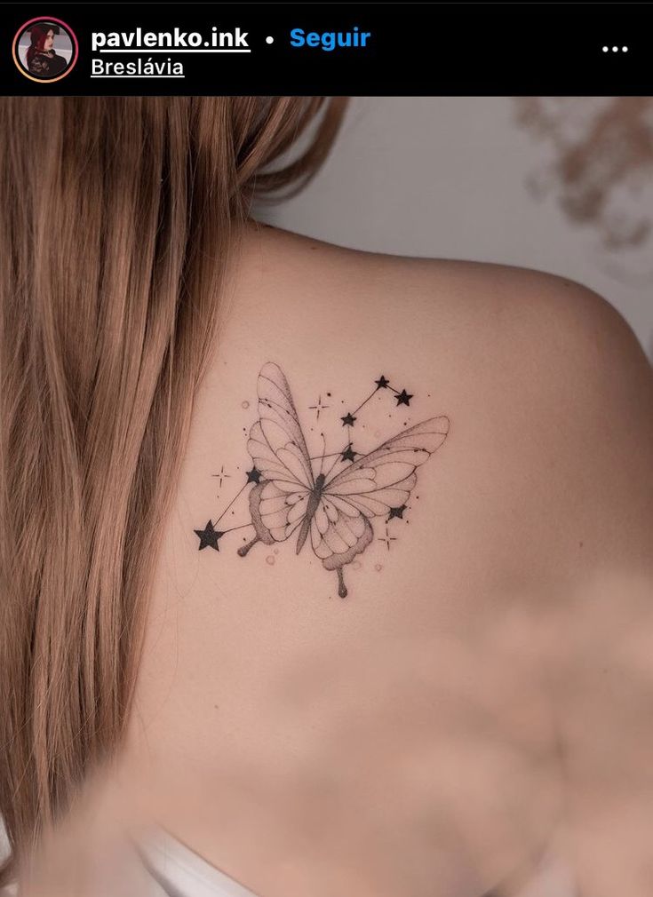 a woman with a butterfly tattoo on her shoulder