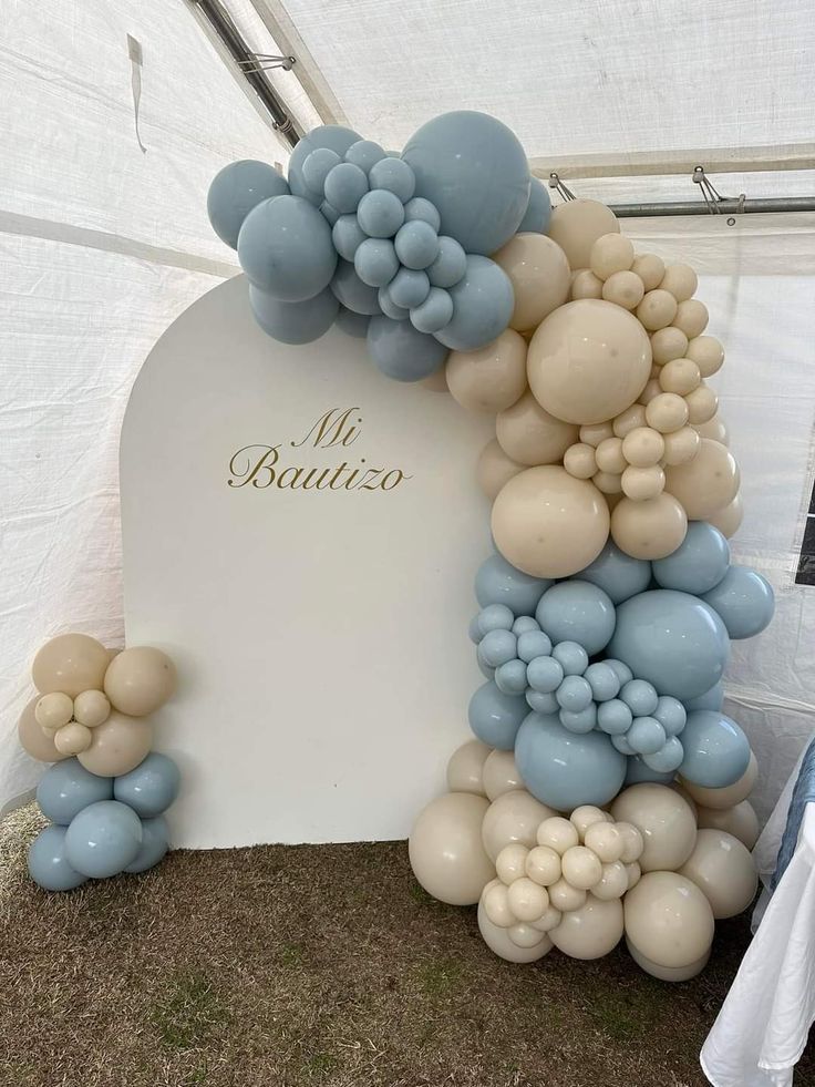 an arch made out of balloons with the words mr and mrs written on it