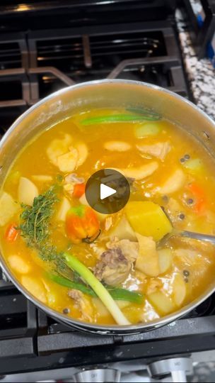 a pot filled with food sitting on top of a stove