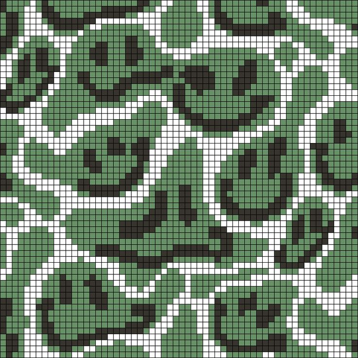 a green and black pixellated pattern with white dots on the bottom, which has been made up to look like an alien face