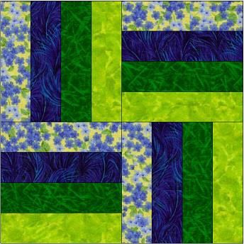 a green and blue quilt with flowers on it