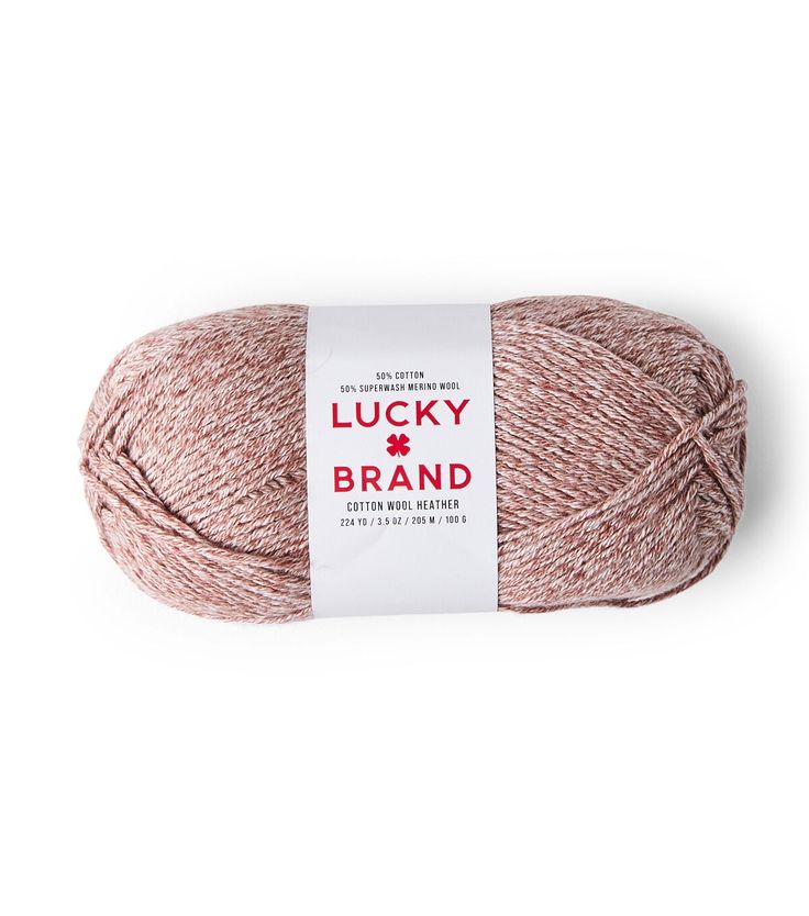 a ball of yarn with the label lucky brand on it, in pink and white