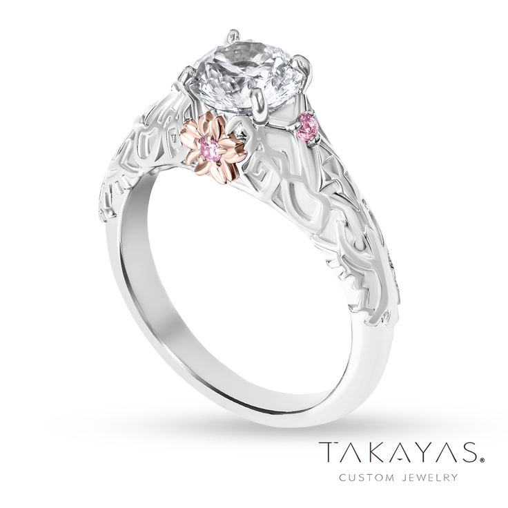 a white gold engagement ring with pink and white diamonds