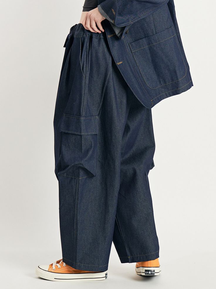 Editor's NotesThese balloon pants are built with room to move, and relaxed through the hip and thigh, with a full leg.These cargo pants are made with cotton.- Side pockets- Balloon cargo pants with elastic waistband- Wide leg pants- Pintuck design on the bottom of the pants Measurements(in.)One size- Total length: 37.8in.- Waist: 13.39 to 20.08in. - Hips: 27.47in.- Thigh: 17.39in. - Front rise: 16.6in.- Leg opening: 10.24in.Model Size Woman Height - 5’ 57”Weight - 110lbM Denim Blue Cropped Pants With Side Pockets, Cropped Denim Blue Pants With Side Pockets, Baggy Cropped Leg Pants With Pockets, Baggy Cropped Pants With Pockets, Relaxed Fit Jeans With Multiple Pockets And Tapered Leg, Baggy Denim Cargo Pants With Tapered Leg, Relaxed Fit Cropped Cargo Jeans With Pockets, Relaxed Fit Tapered Leg Jeans With Multiple Pockets, Baggy Dark Wash Utility Bottoms