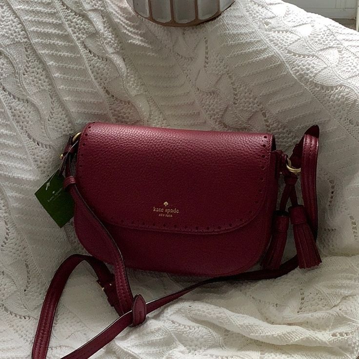 Description: Kate Spade Adelaide James Street Crossbody Wkru4581 New With Tags Details: Pebbled Leather Color: Merlot Adjustable Shoulder Or Crossbody Strap With 21”-23” Drop Flap Magnetic Closure Interior: One Slip Pocket One Zip Pocket. Approximate Size: 9”(L) X 6-1/4”(H) X 3-1/4”(D) Late Spade Bags, Dark Red Shoulder Bag, Kate Spade Purse Aesthetic, Crossbody Purse Outfit, Dark Red Purse, Fall Purses, Purse Aesthetic, Burgundy Purse, Side Purses