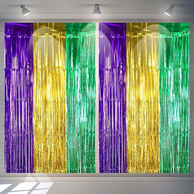 a room filled with lots of different colored glass curtaines in front of a window