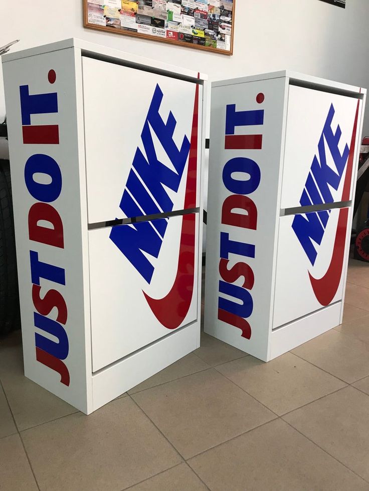 two white refrigerators with red and blue logos on them