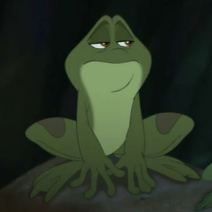 a cartoon frog sitting on top of a rock in the dark with its eyes wide open